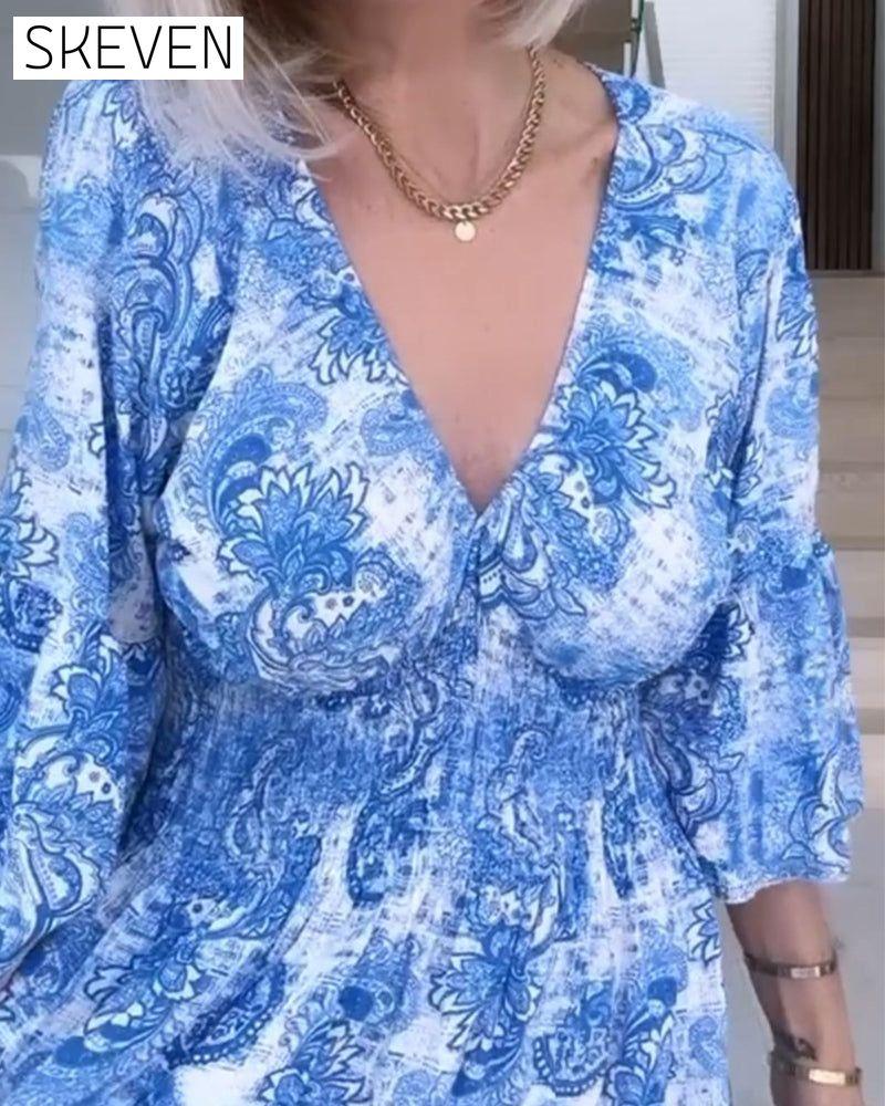 V-neck belted printed flowy dress