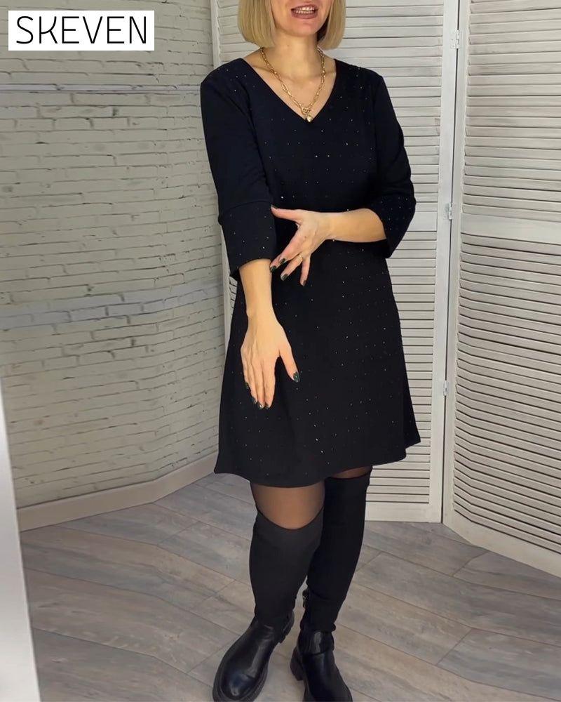 Robe élégante à col en V et manches trois-quarts