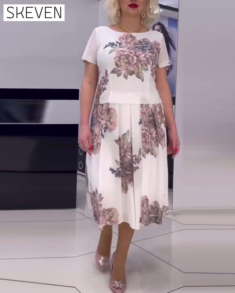 Elegantes Kleid mit Blumenmuster und Rundhalsausschnitt
