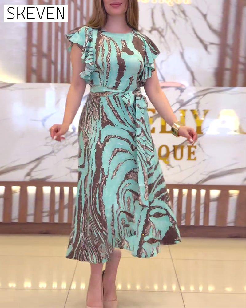 Elegantes Kleid mit Kontrastmuster und Rüschen