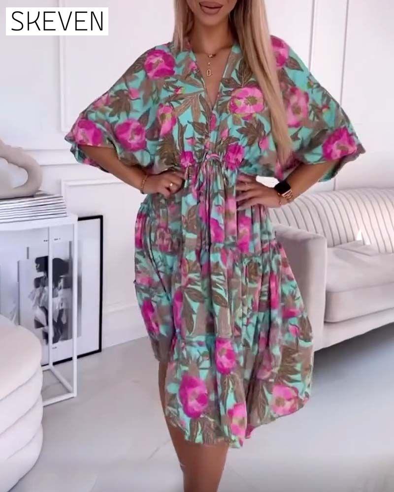 Elegant dress with drawstring ties and floral print