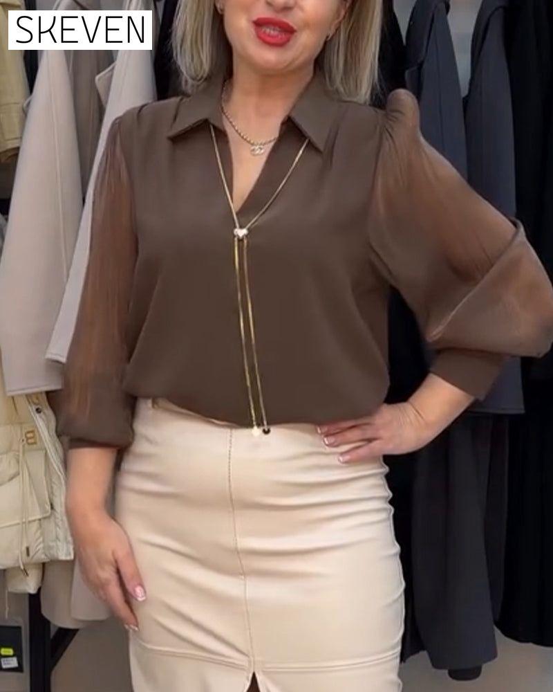 Elegante, transparente Bluse mit Kragen und Puffärmeln