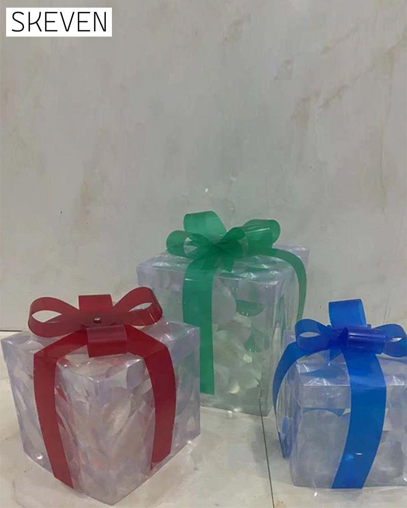 Weihnachtsdekorationen in Form von leuchtenden Geschenkboxen