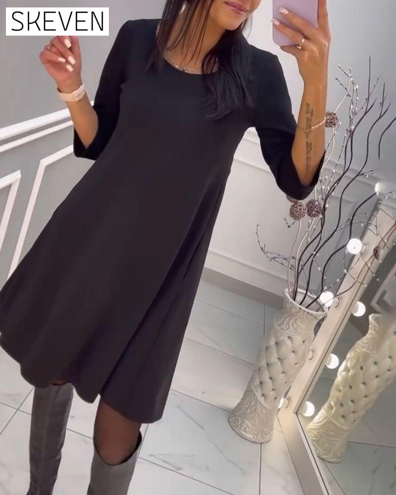Solid color dress with bow at back