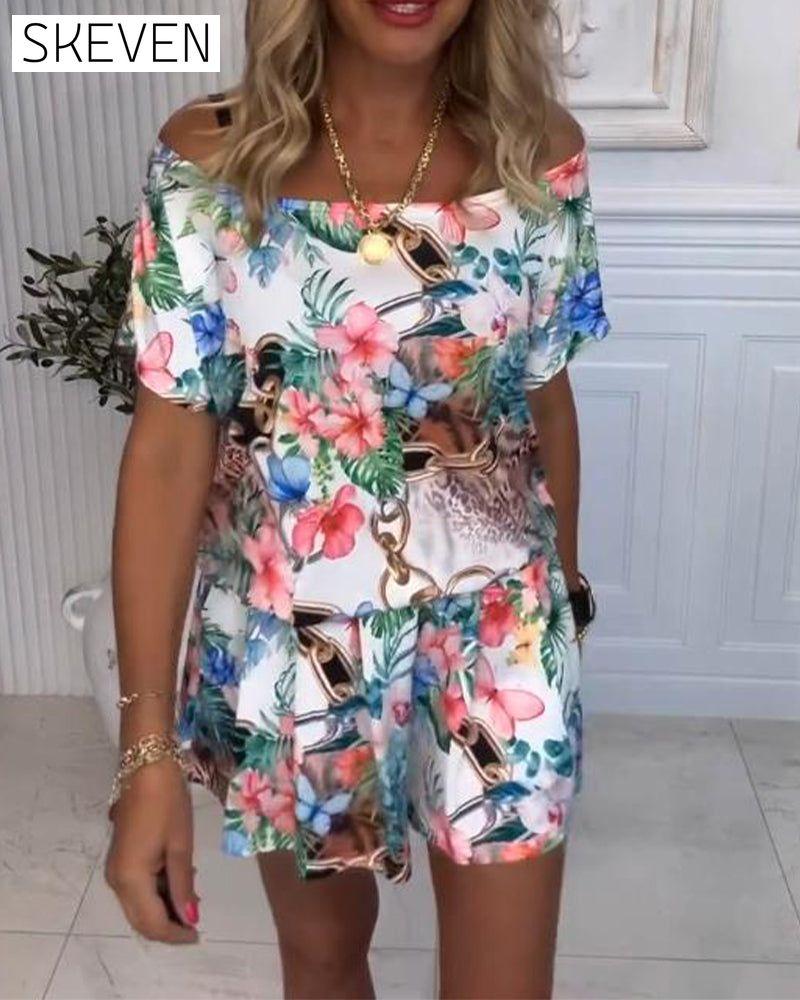 Jumpsuit mit Pflanzen- und Blumenmuster und schulterfreiem Ausschnitt