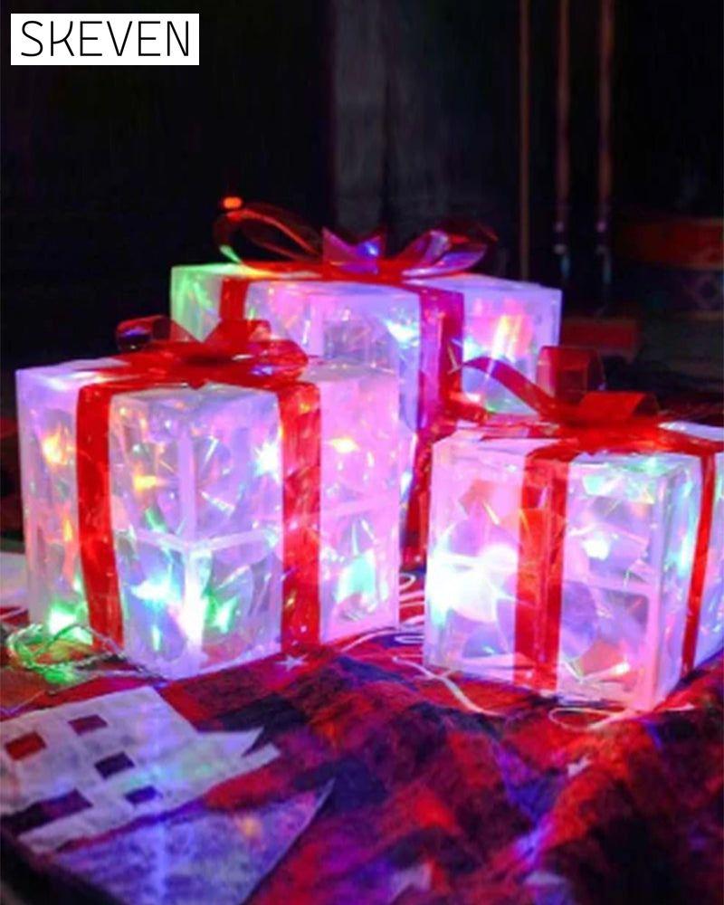 Weihnachtsdekorationen in Form von leuchtenden Geschenkboxen