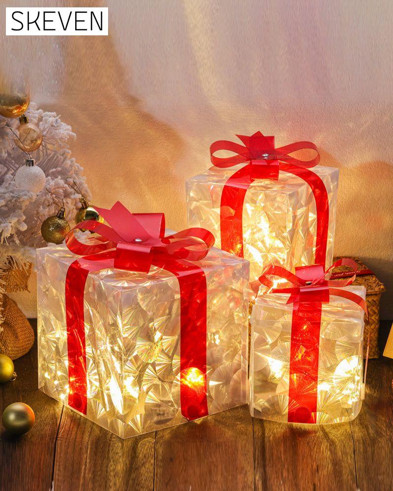 Weihnachtsdekorationen in Form von leuchtenden Geschenkboxen