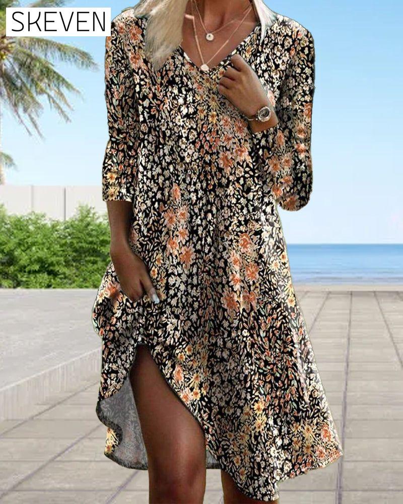 Elegantes Kleid mit langen Ärmeln und Blumenmuster