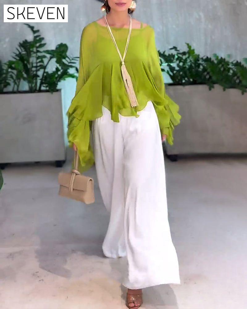 Modische Bluse in Unifarben mit schwungvollem Design