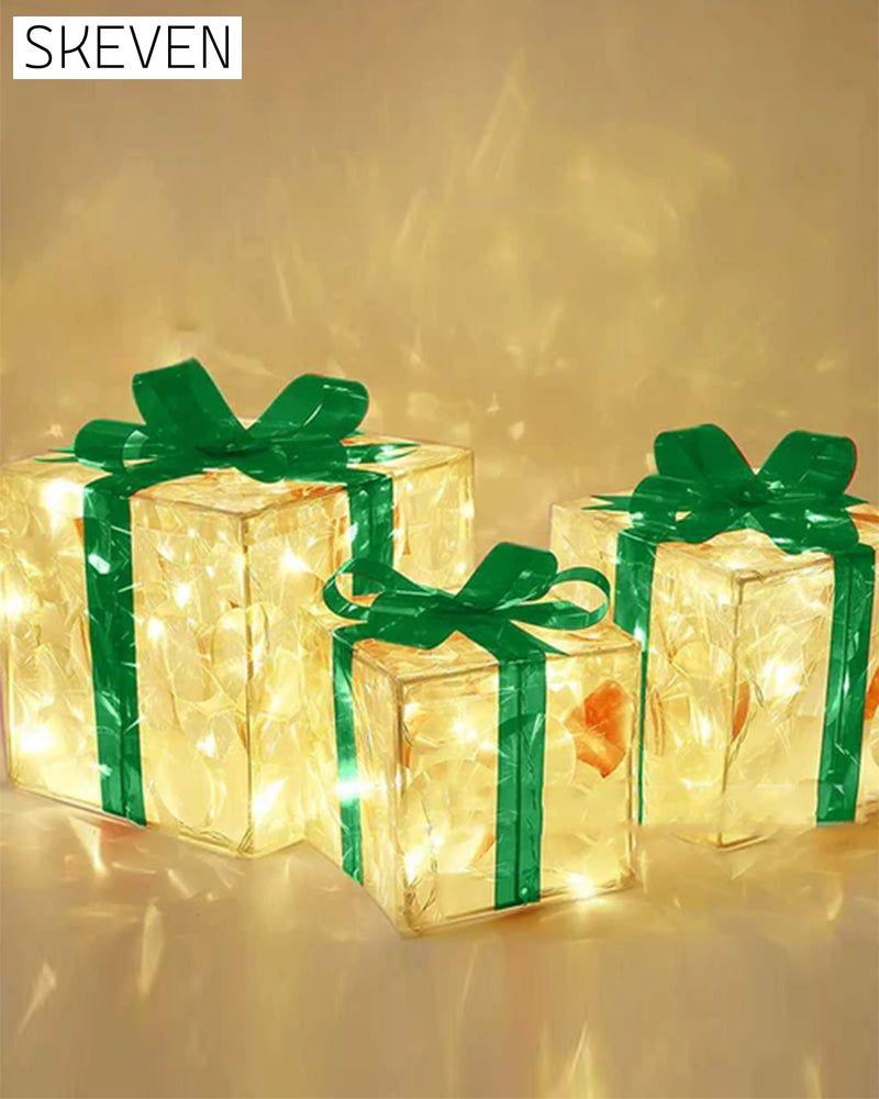 Weihnachtsdekorationen in Form von leuchtenden Geschenkboxen