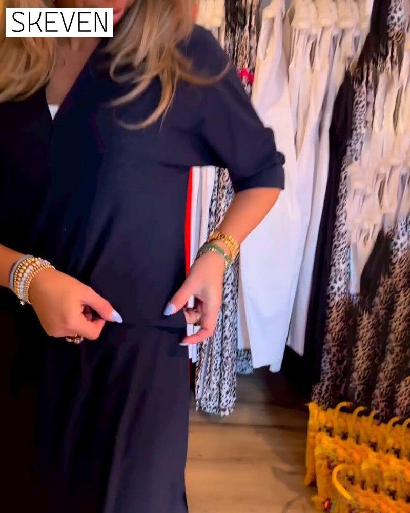 Kleid mit V-Ausschnitt und Taschen