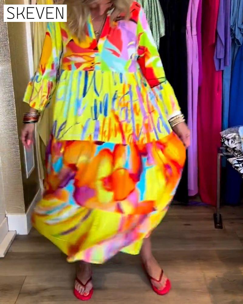 Bedrucktes Kleid mit ausgestellten Ärmeln