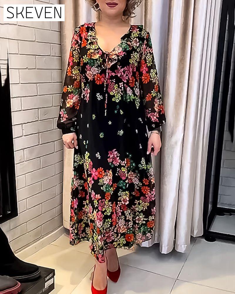 Elegantes Kleid mit Blumenmuster und V-Ausschnitt