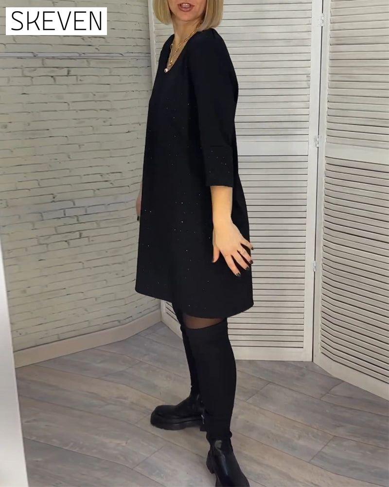 Robe élégante à col en V et manches trois-quarts