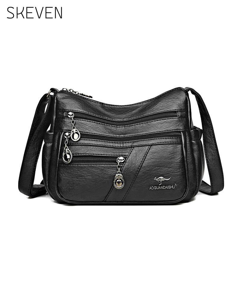 Sac bandoulière en cuir souple multipoches