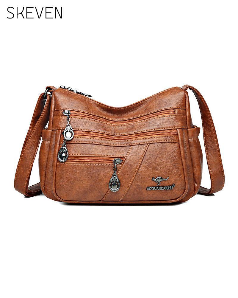 Sac bandoulière en cuir souple multipoches