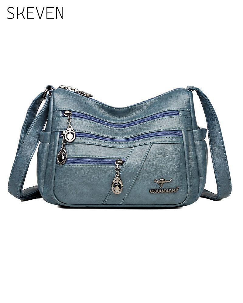Sac bandoulière en cuir souple multipoches