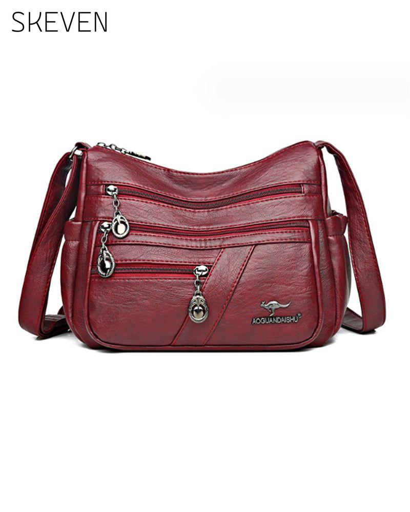 Sac bandoulière en cuir souple multipoches